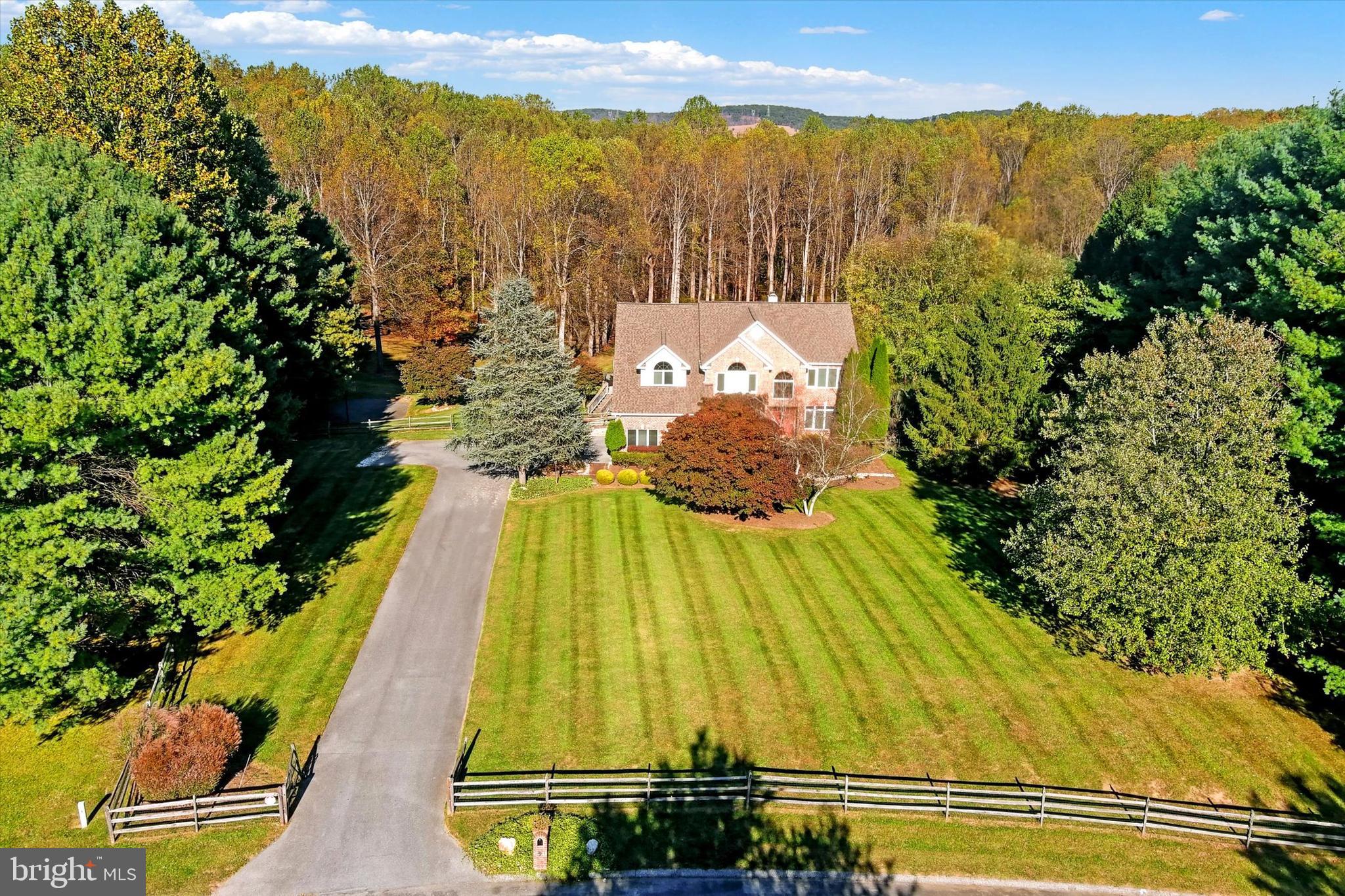 9 Liberty Ridge Court Reisterstown, MD 21136 - Photo 3 of 42 a view of a swimming pool with a lake