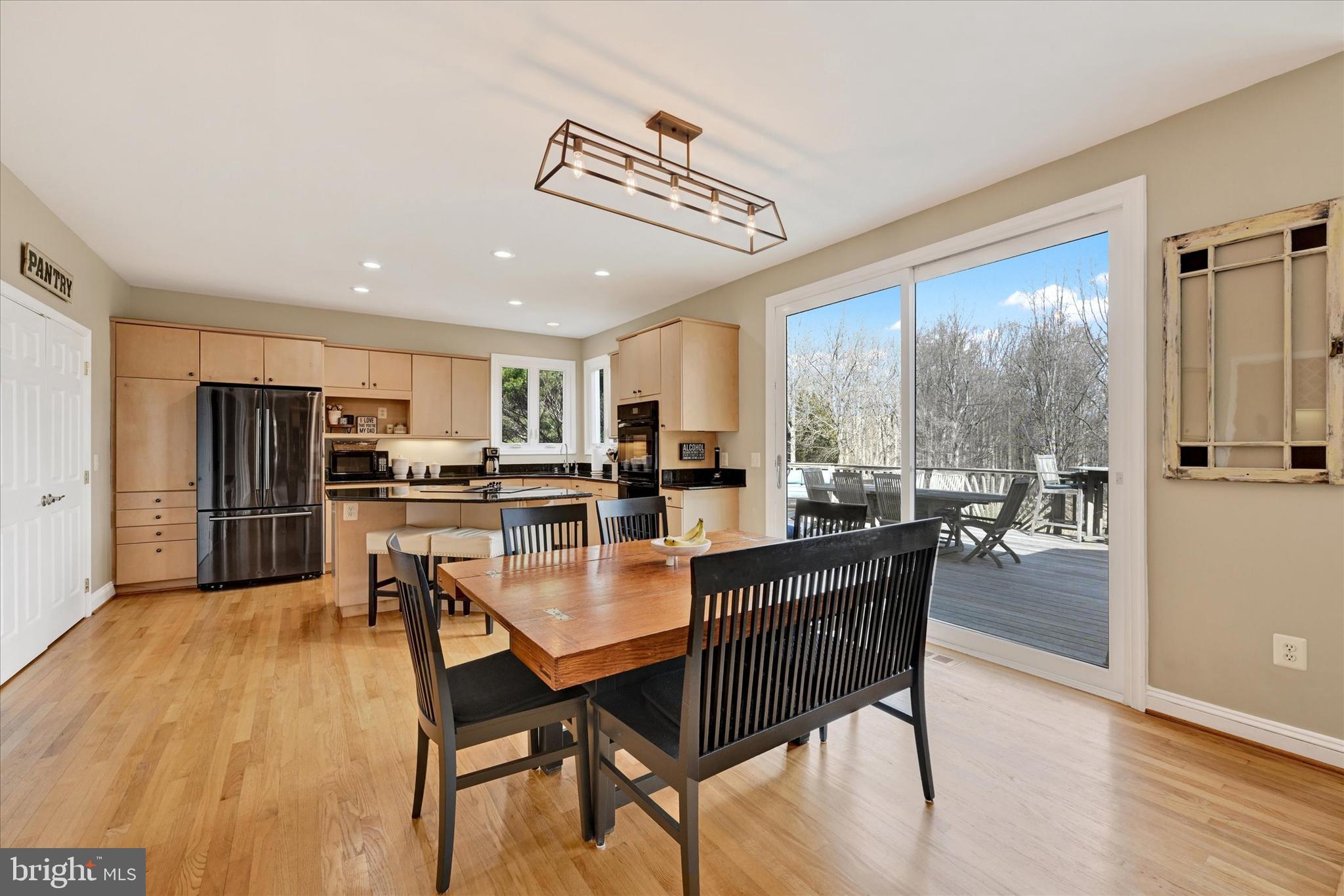 9 Liberty Ridge Court Reisterstown, MD 21136 - Photo 10 of 42 a dining room with furniture and wooden floor