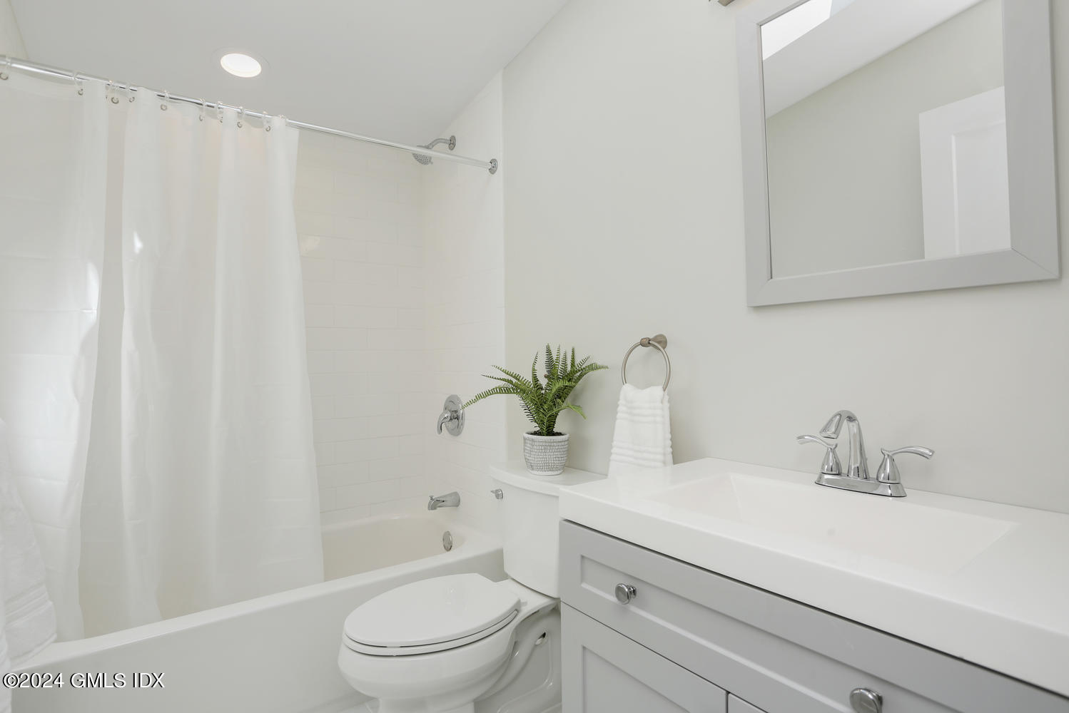 10 Florence Road Riverside, CT 06878 - Photo 11 of 14 a bathroom with a sink a toilet and a mirror