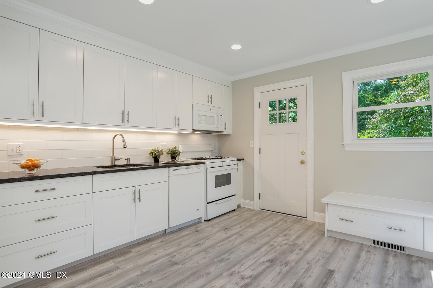 10 Florence Road Riverside, CT 06878 - Photo 2 of 14 a kitchen with granite countertop white cabinets and white appliances