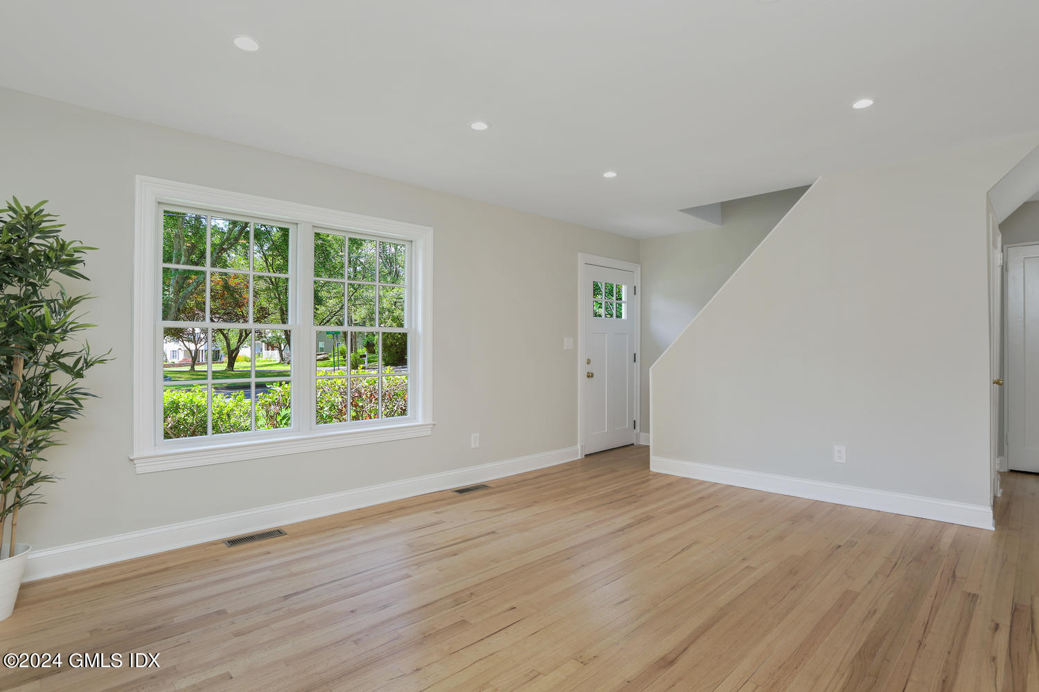 10 Florence Road Riverside, CT 06878 - Photo 4 of 14 an empty room with wooden floor and windows