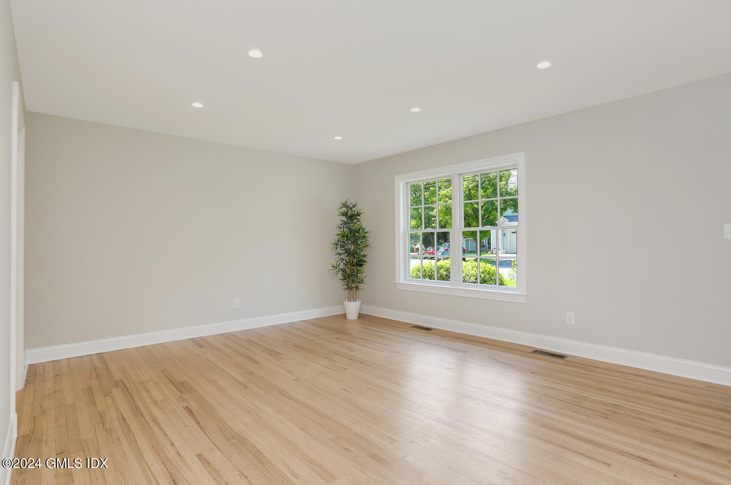 10 Florence Road Riverside, CT 06878 - Photo 5 of 14 an empty room with wooden floor and windows