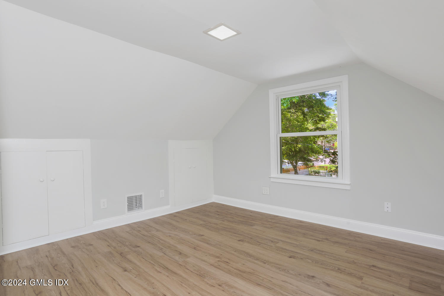 10 Florence Road Riverside, CT 06878 - Photo 10 of 14 an empty room with wooden floor and windows