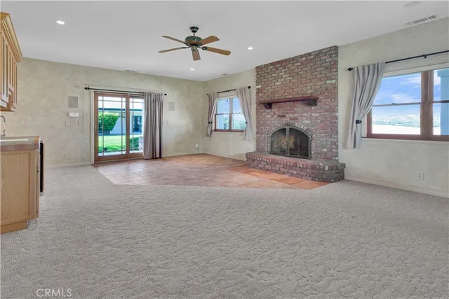a kitchen with stainless steel appliances granite countertop a stove and a refrigerator