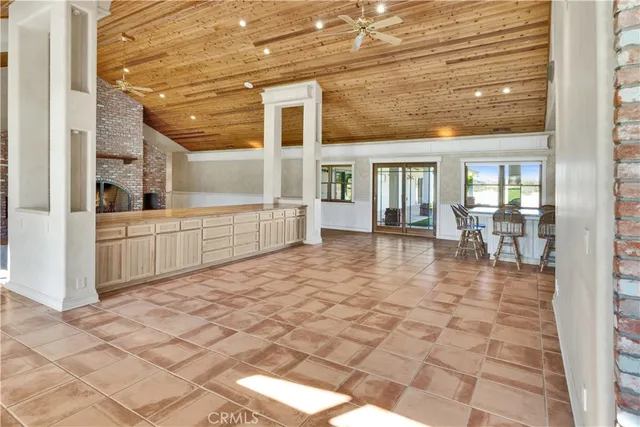 a view of a house with a yard and porch