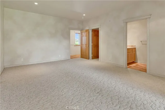 a view of a house with backyard and a tree