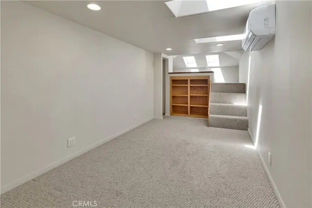 an aerial view of a house with a yard and garden