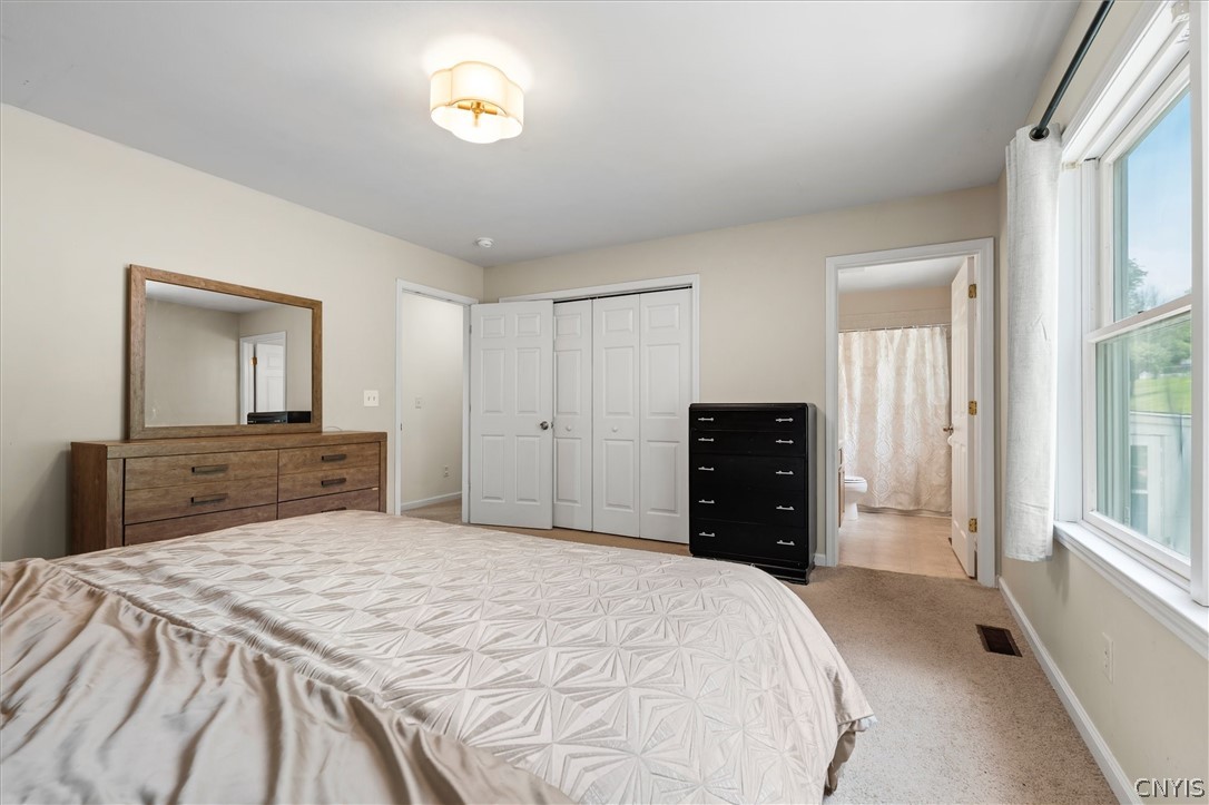 4615 Broad Road Onondaga, NY 13215 - Photo 24 of 47 Well-appointed primary bedroom with ample closet s