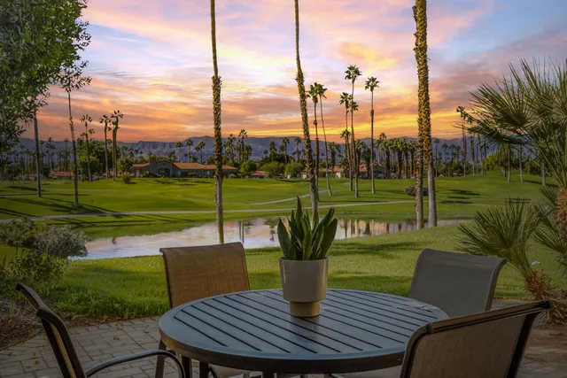 a view of a table and chairs in the yard
