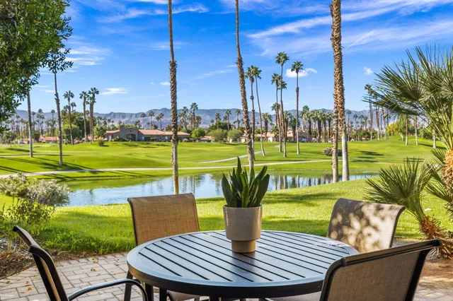 a view of a chairs and table in the patio