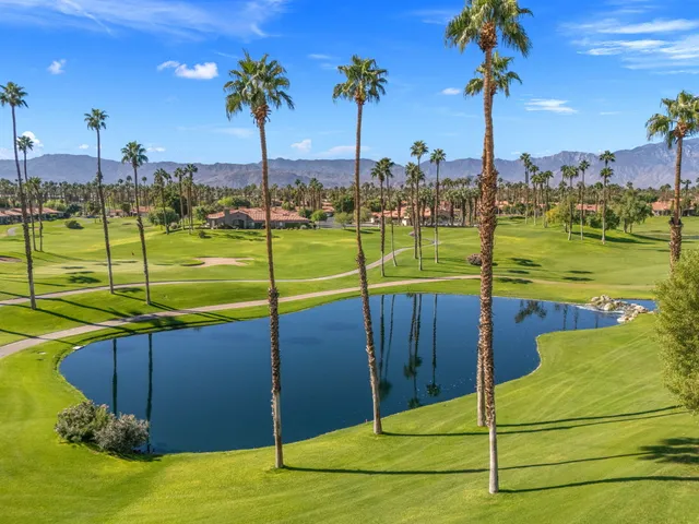 a patio with yard and outdoor seating