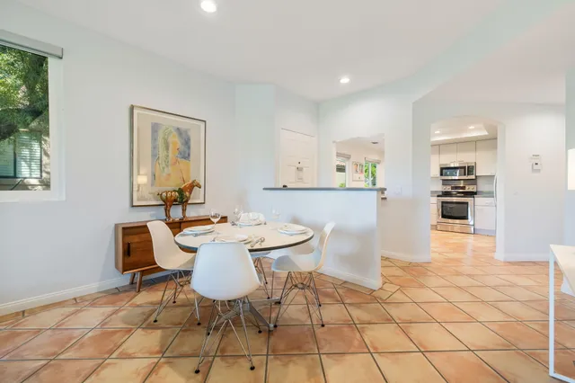 a kitchen with a stove a sink and a microwave