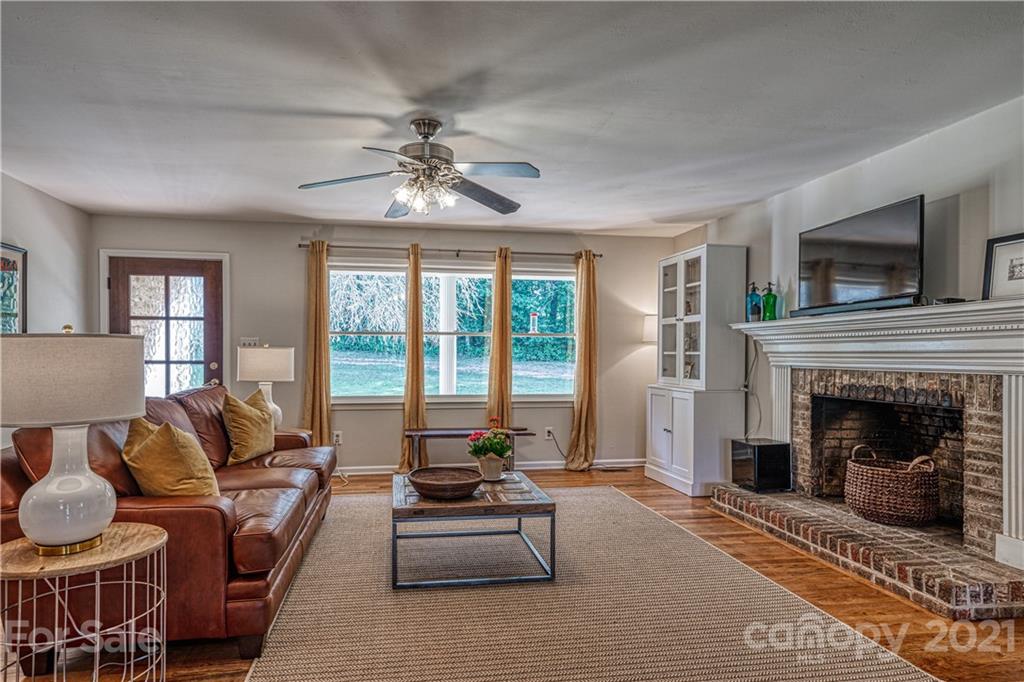 3705 River Road Hickory, NC 28602 - Photo 11 of 48 a living room with furniture and a fireplace