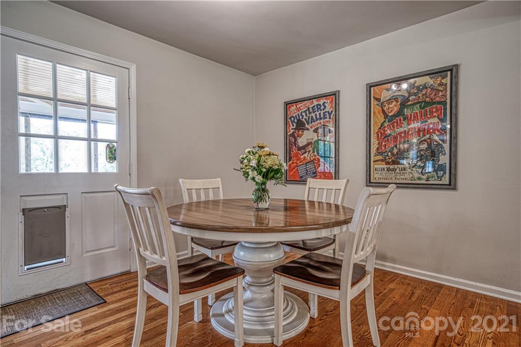 3705 River Road Hickory, NC 28602 - Photo 13 of 48 a view of a dining room with furniture and wooden floor