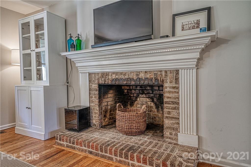 3705 River Road Hickory, NC 28602 - Photo 15 of 48 a close view of a livingroom with wooden floor and a fireplace