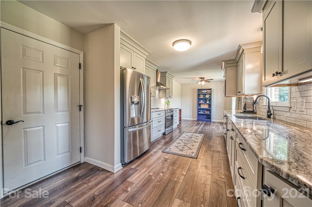 3705 River Road Hickory, NC 28602 - Photo 16 of 48 a view of a kitchen with wooden floor and a sink