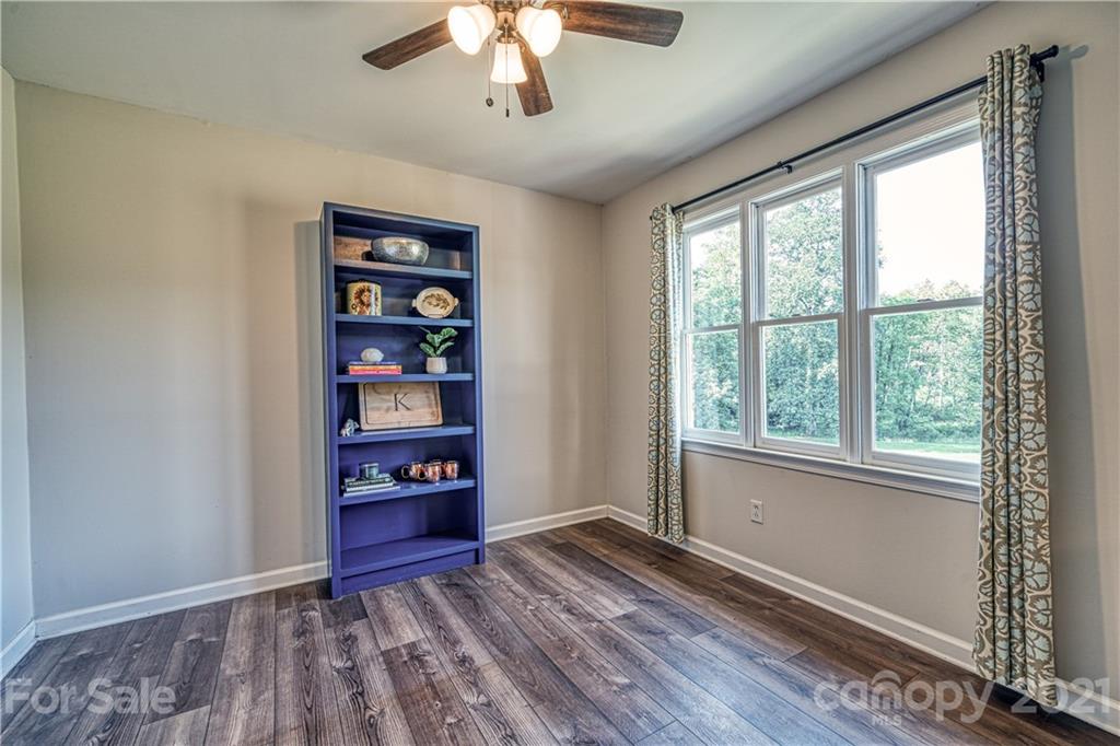 3705 River Road Hickory, NC 28602 - Photo 21 of 48 a view of an empty room with a window and wooden floor