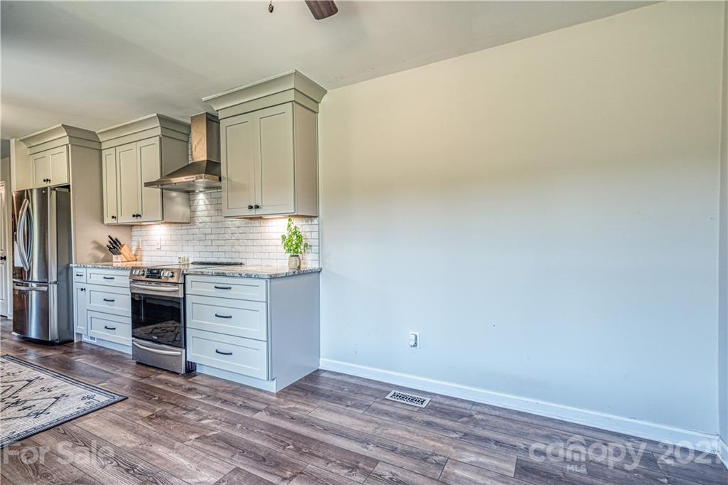 3705 River Road Hickory, NC 28602 - Photo 22 of 48 a room with a dresser and a chandelier