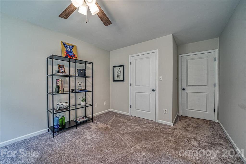 3705 River Road Hickory, NC 28602 - Photo 29 of 48 a view of a livingroom with a book shelf