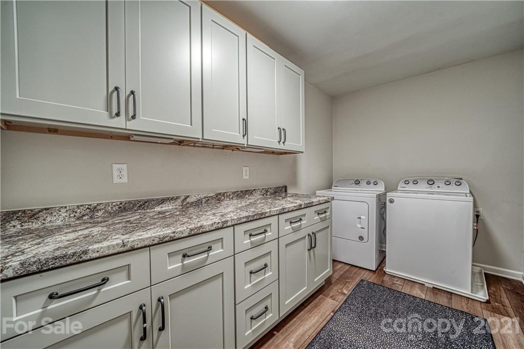 3705 River Road Hickory, NC 28602 - Photo 34 of 48 a kitchen with cabinets appliances and a counter top