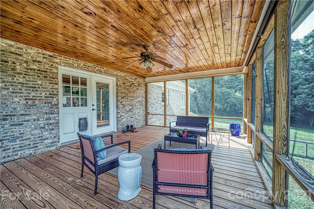 3705 River Road Hickory, NC 28602 - Photo 36 of 48 a balcony with wooden floor and furniture
