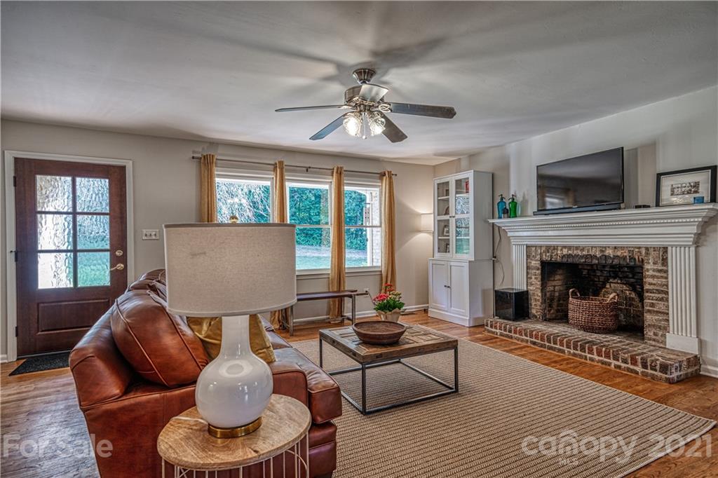 3705 River Road Hickory, NC 28602 - Photo 10 of 48 a living room with furniture and a fireplace