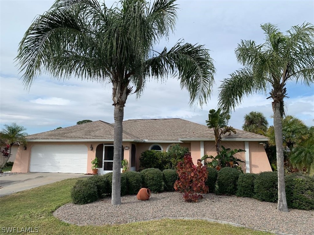 26324 Hong Kong Road Punta Gorda, FL 33983 - Photo 1 of 18 front view of a house with a yard