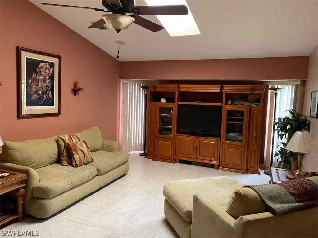 26324 Hong Kong Road Punta Gorda, FL 33983 - Photo 12 of 18 a bedroom with a bed and a couch