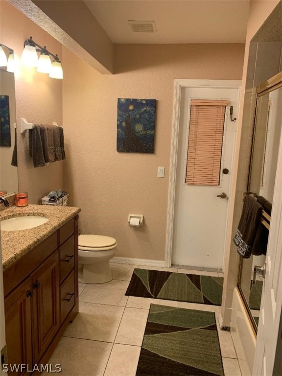26324 Hong Kong Road Punta Gorda, FL 33983 - Photo 16 of 18 a bathroom with a granite countertop sink toilet and mirror