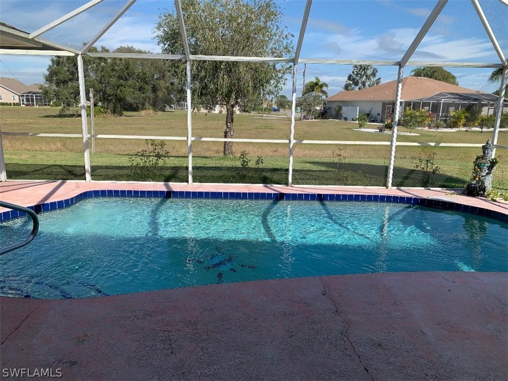 26324 Hong Kong Road Punta Gorda, FL 33983 - Photo 2 of 18 a view of a backyard with swimming pool