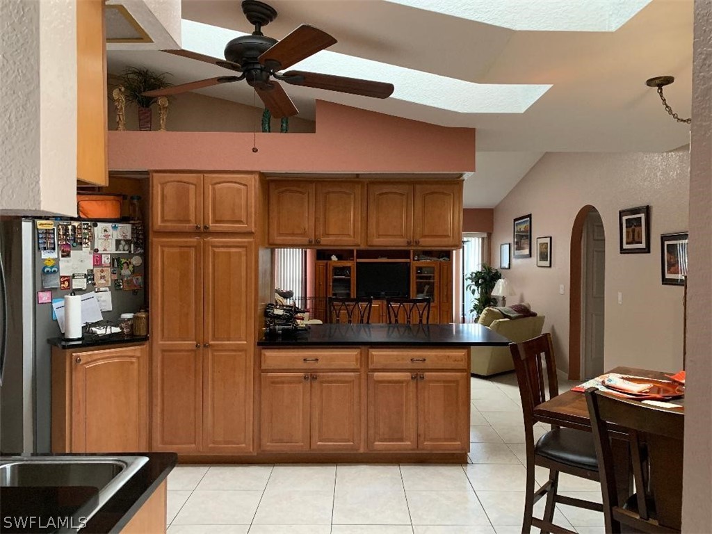 26324 Hong Kong Road Punta Gorda, FL 33983 - Photo 6 of 18 a kitchen with a cabinets and chandelier