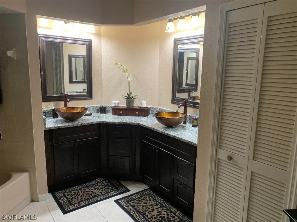 26324 Hong Kong Road Punta Gorda, FL 33983 - Photo 9 of 18 a kitchen with a sink and cabinets