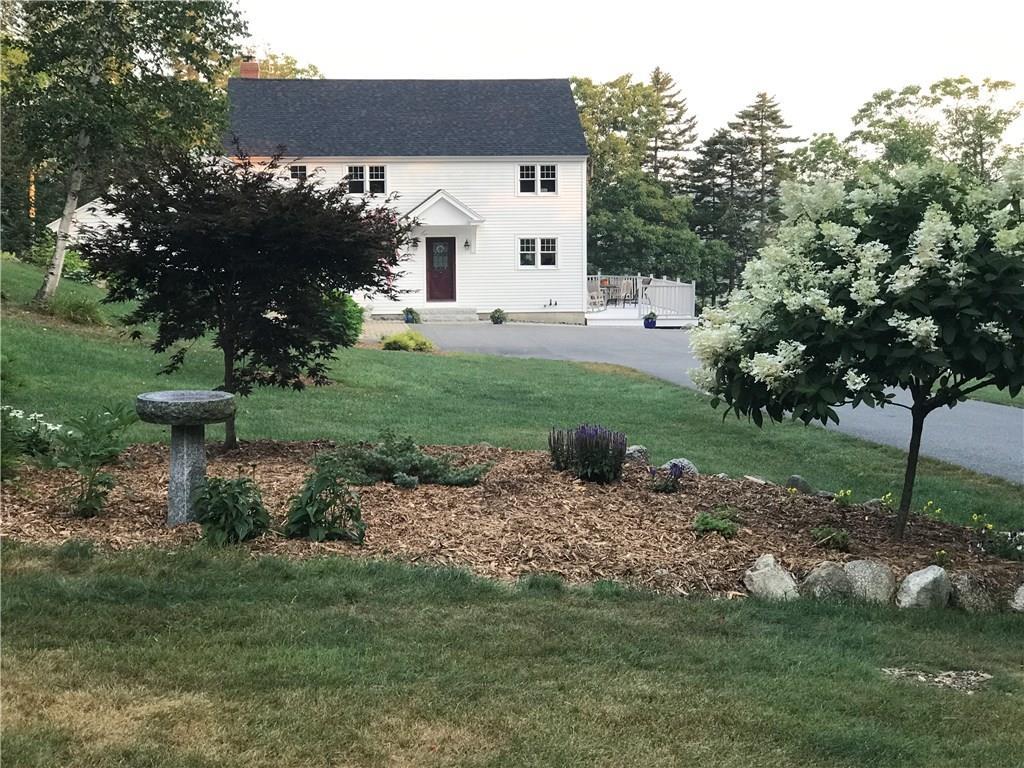 36 Hatch Cove Drive Castine, ME 04421 - Photo 2 of 28 Attractive gardens and trees line...