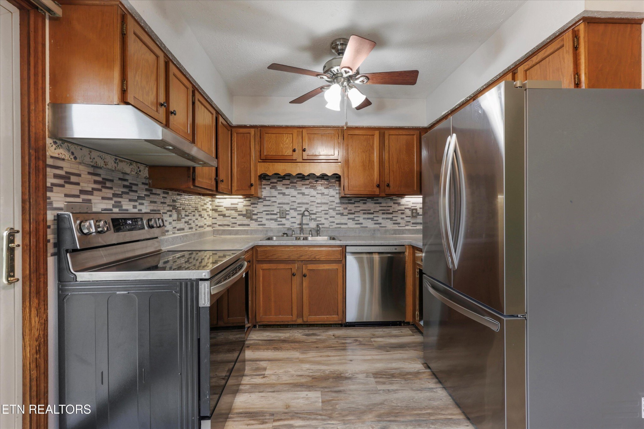 47 Paint Rock Ferry Road Kingston, TN 37763 - Photo 8 of 38 a kitchen with stainless steel appliances granite countertop a refrigerator a sink and dishwasher