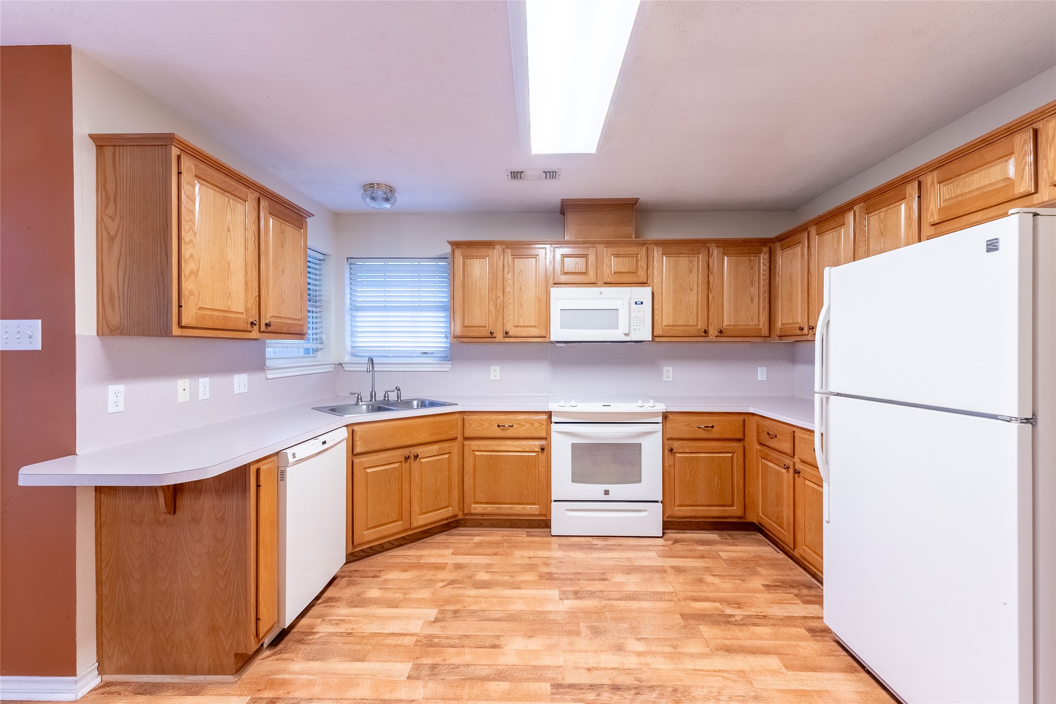 4802 Treadgold Lane Bryan, TX 77802 - Photo 11 of 28 a kitchen with granite countertop stainless steel appliances a refrigerator sink and microwave