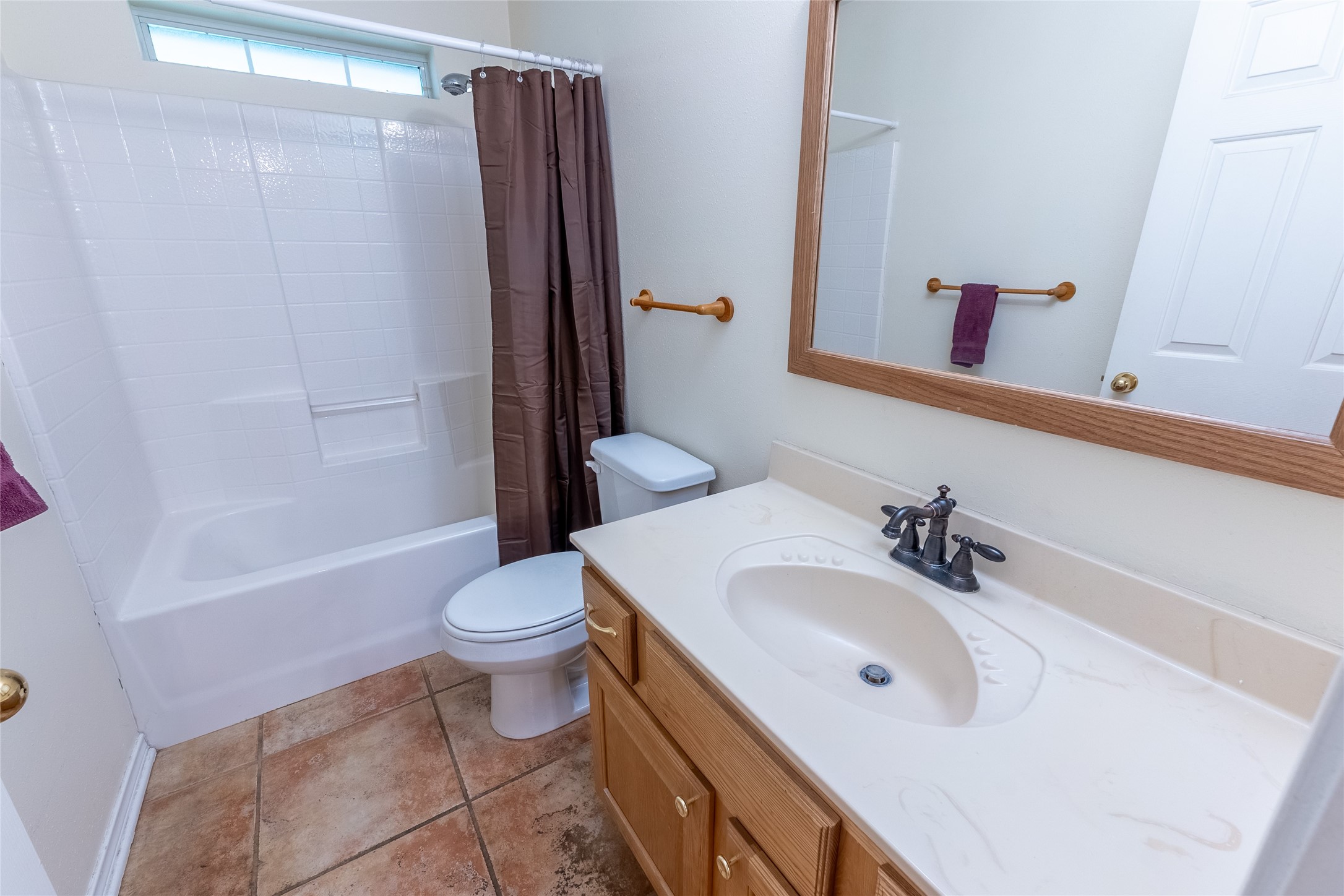 4802 Treadgold Lane Bryan, TX 77802 - Photo 19 of 28 a bathroom with a sink a toilet and shower