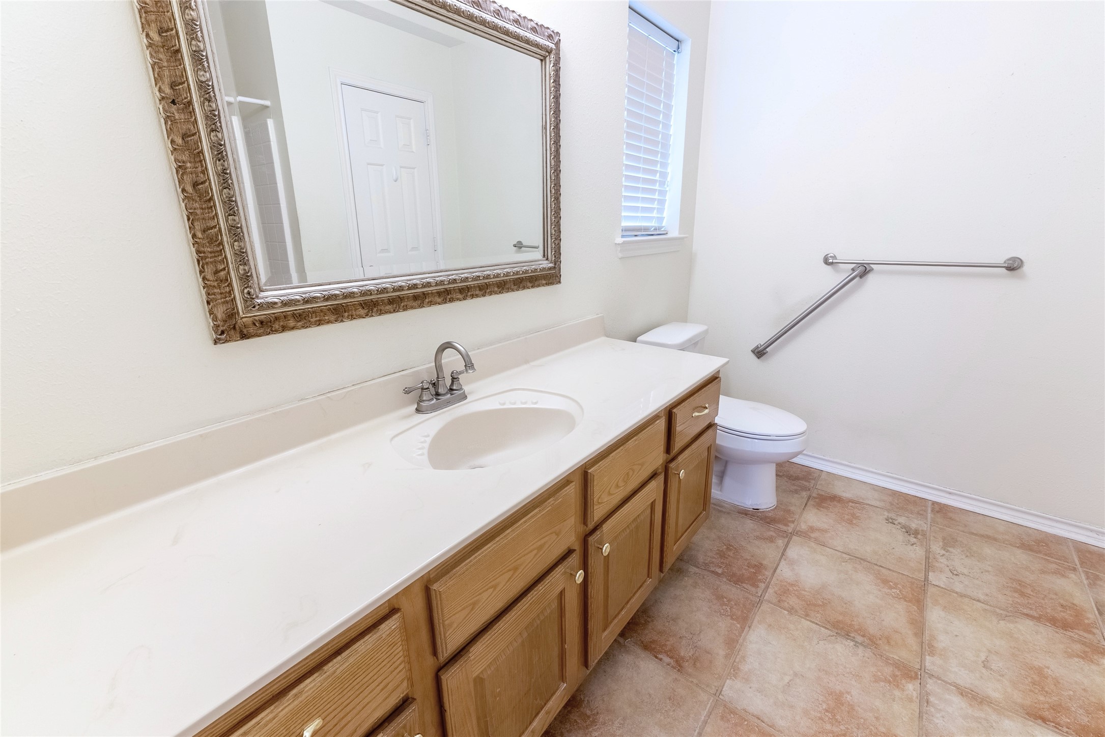 4802 Treadgold Lane Bryan, TX 77802 - Photo 20 of 28 a bathroom with a sink and a mirror