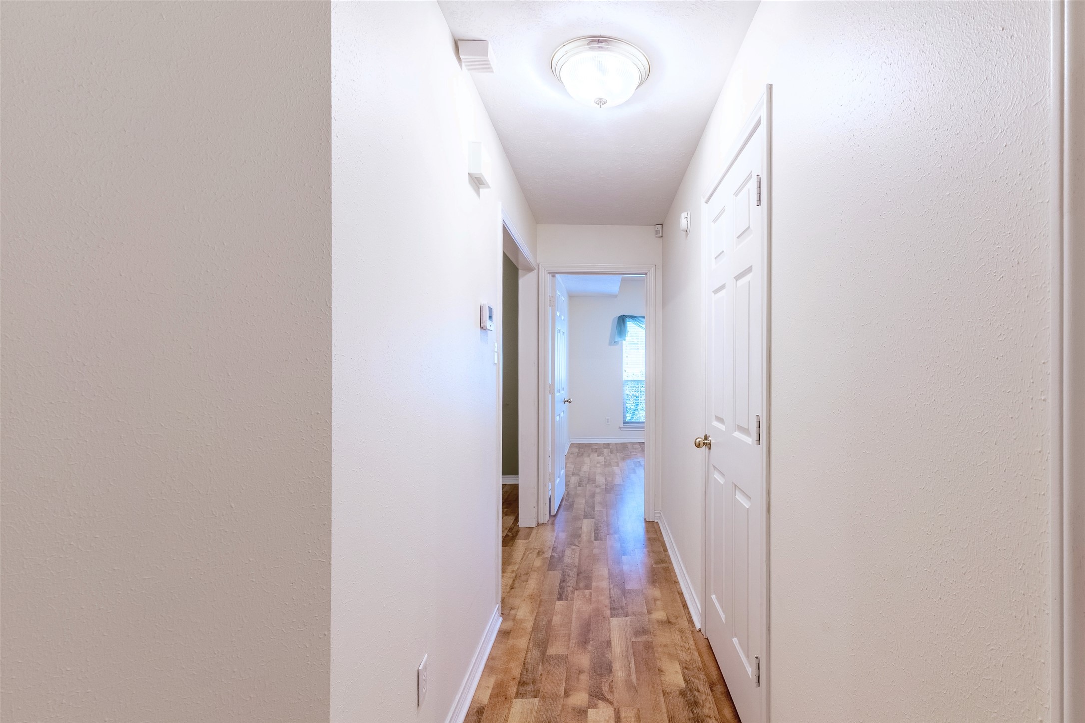 4802 Treadgold Lane Bryan, TX 77802 - Photo 22 of 28 a view of a hallway with a white walls