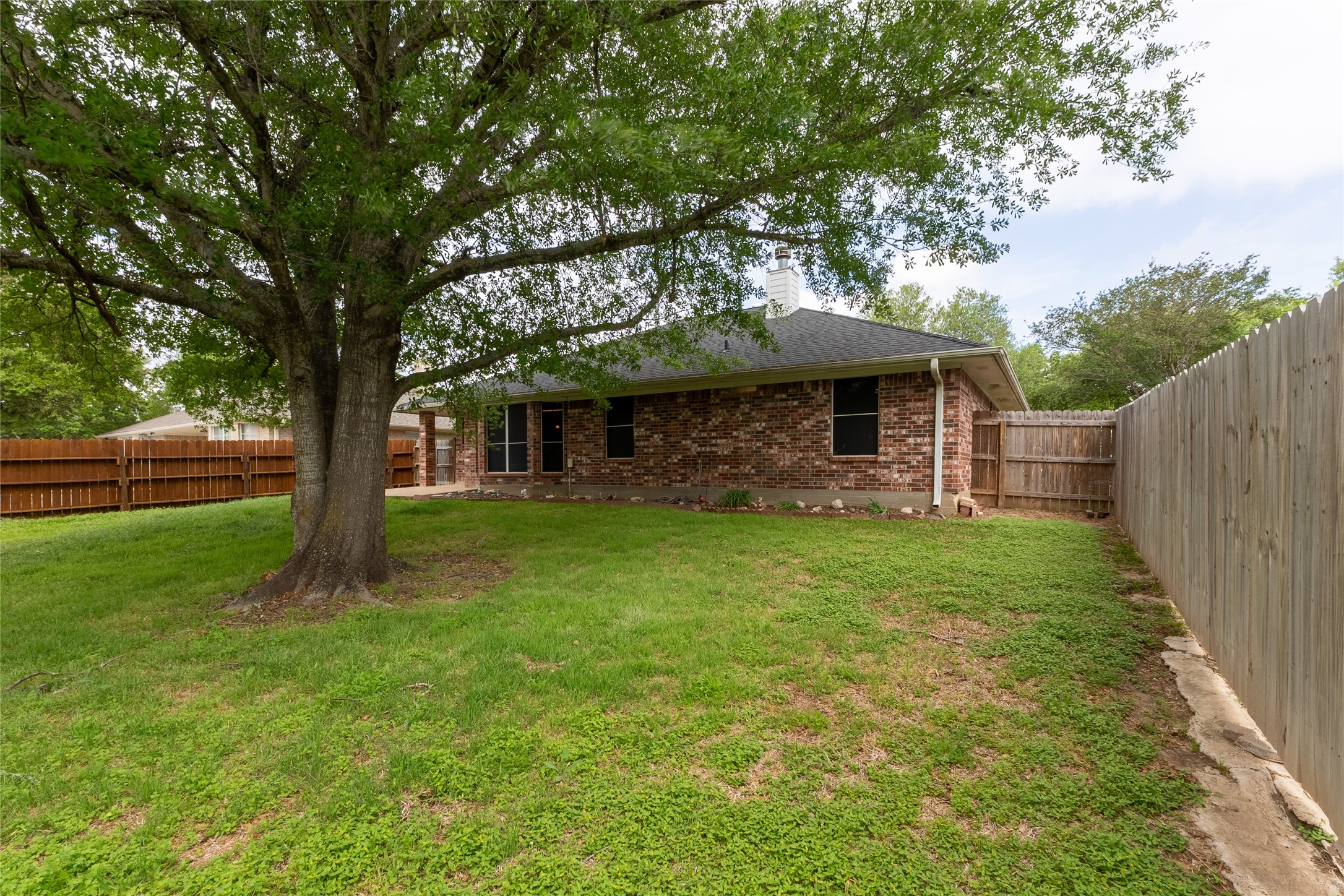 4802 Treadgold Lane Bryan, TX 77802 - Photo 25 of 28 a front view of a house with garden