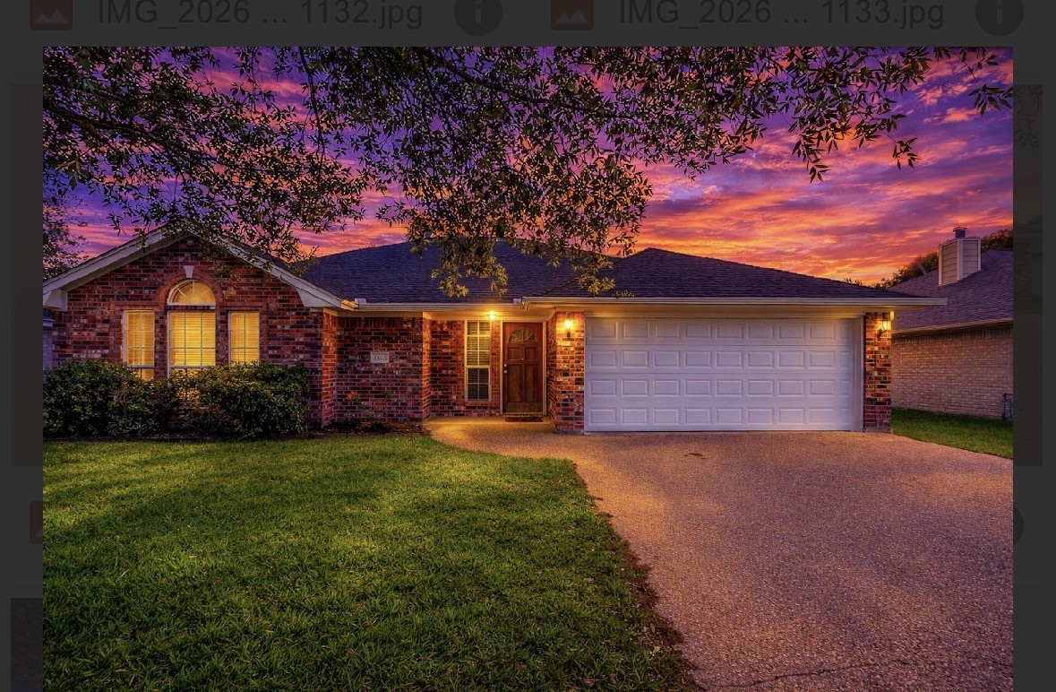 4802 Treadgold Lane Bryan, TX 77802 - Photo 28 of 28 a front view of a house with a yard and garage