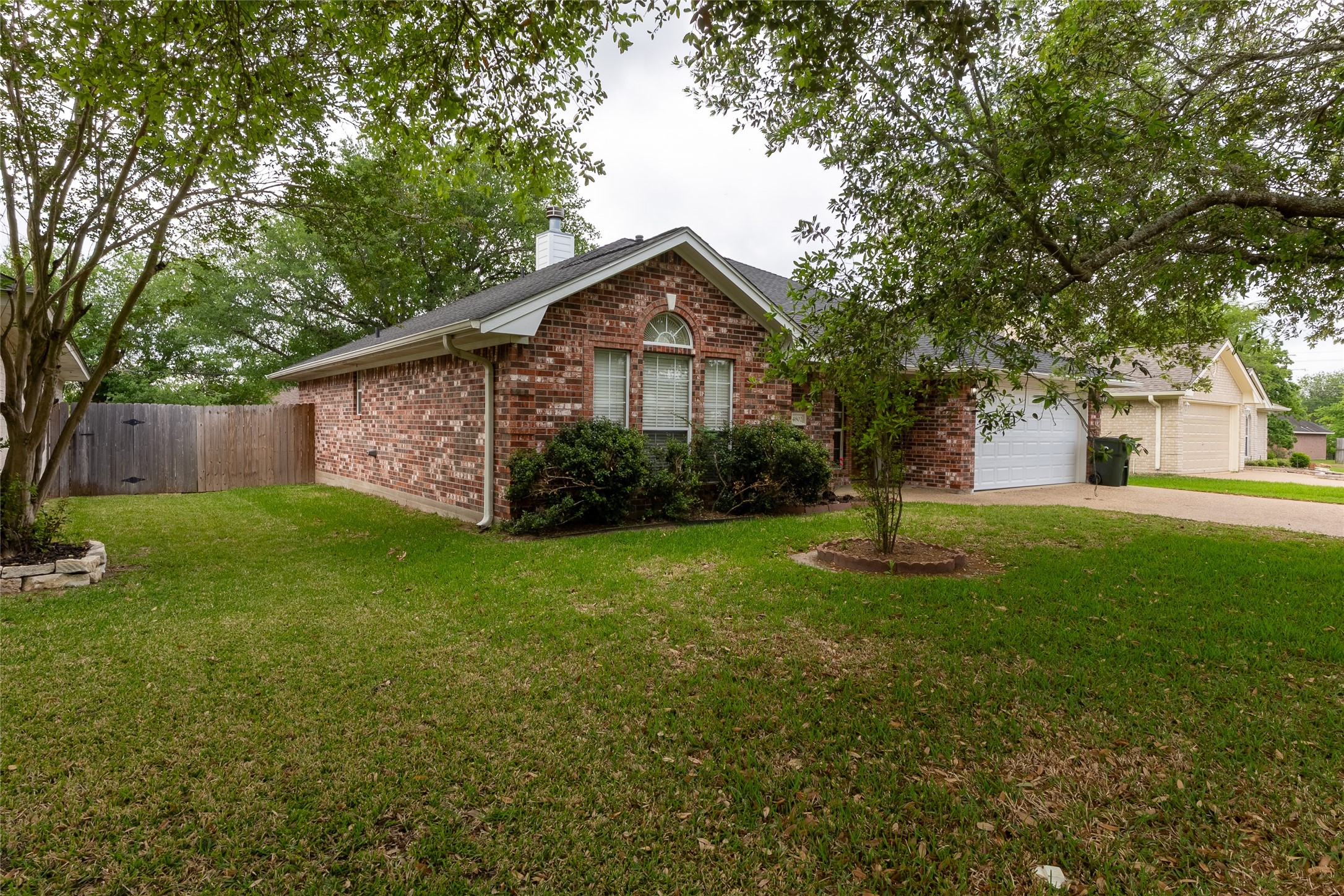 4802 Treadgold Lane Bryan, TX 77802 - Photo 3 of 28 a front view of a house with garden