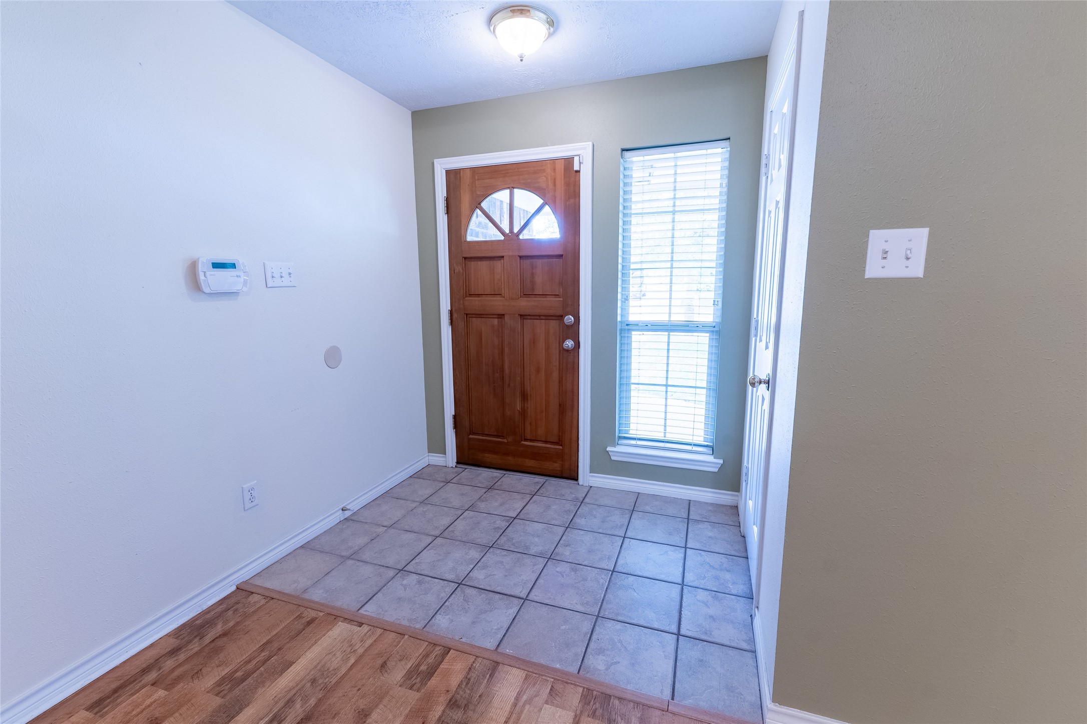 4802 Treadgold Lane Bryan, TX 77802 - Photo 9 of 28 a view of an empty room and window