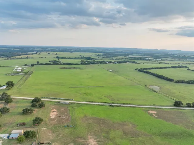 an aerial view of a golf course with a ocean view