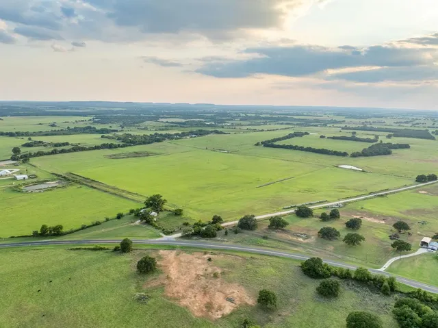 an aerial view of a houses with outdoor space
