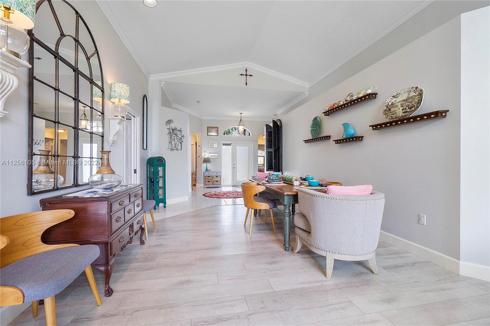 7677 Doubleton Drive Delray Beach, FL 33446 - Photo 19 of 42 a living room with furniture and window
