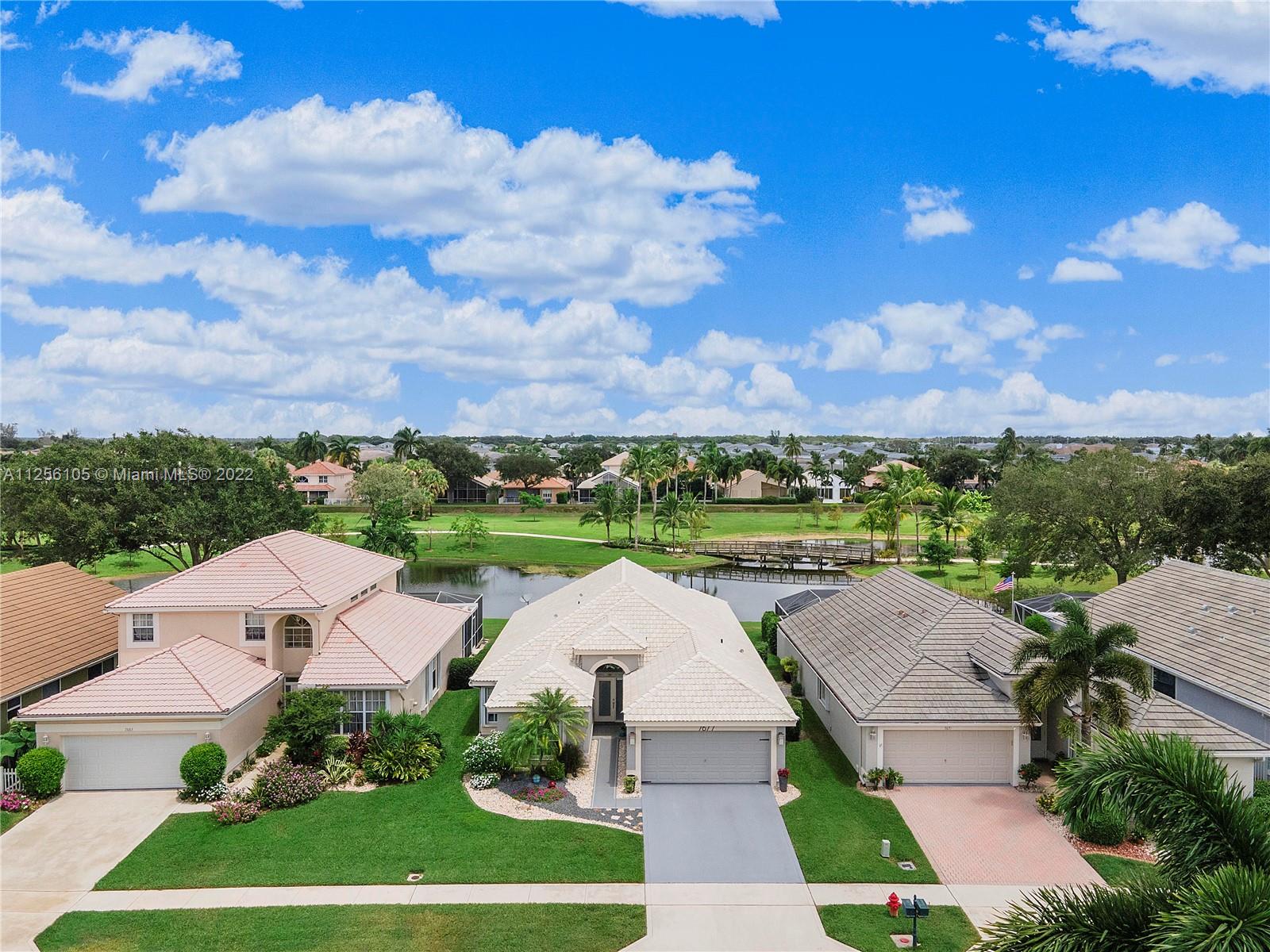 7677 Doubleton Drive Delray Beach, FL 33446 - Photo 2 of 42 a view of a city