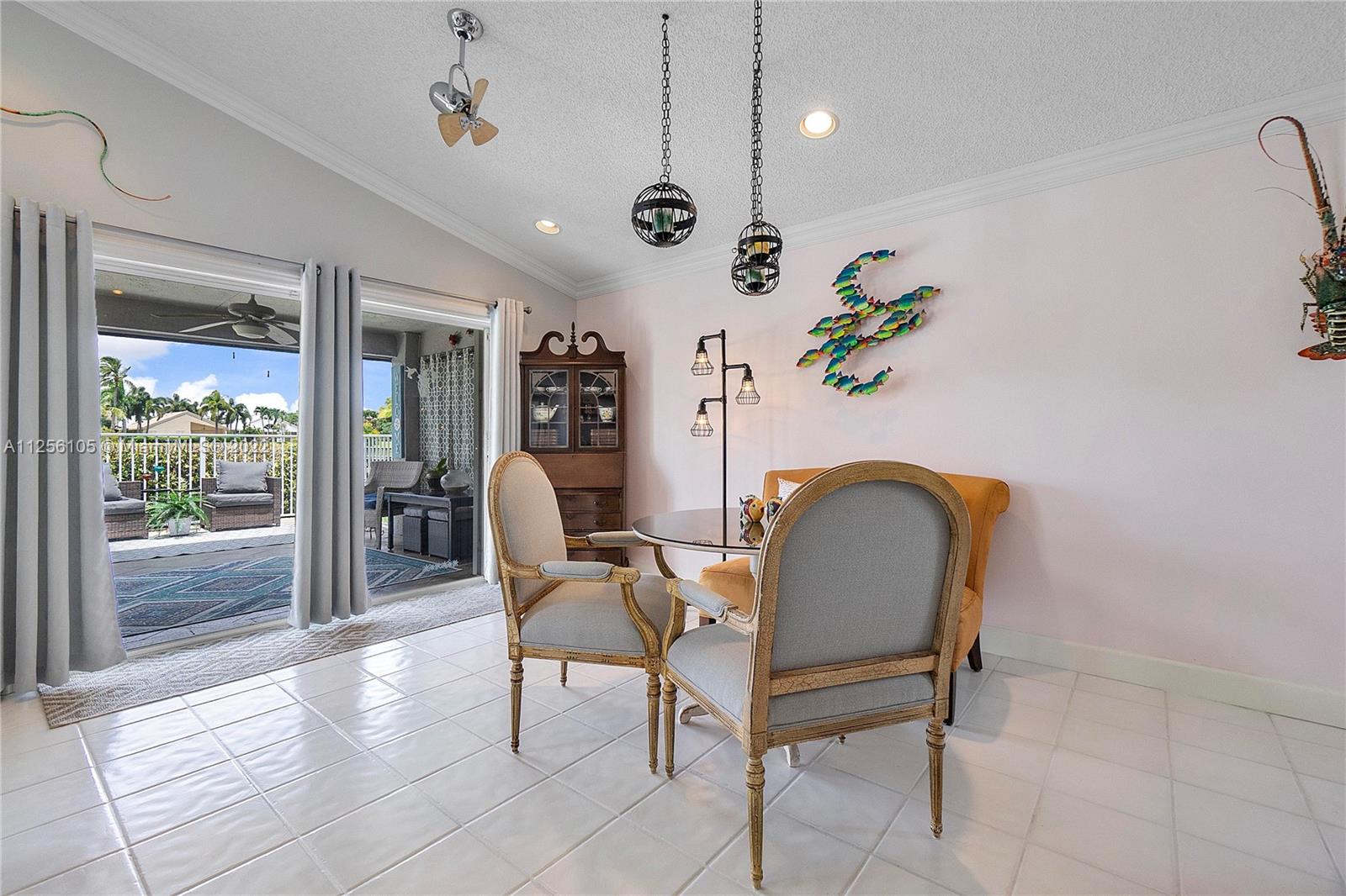 7677 Doubleton Drive Delray Beach, FL 33446 - Photo 28 of 42 a view of a livingroom with furniture and a floor to ceiling window