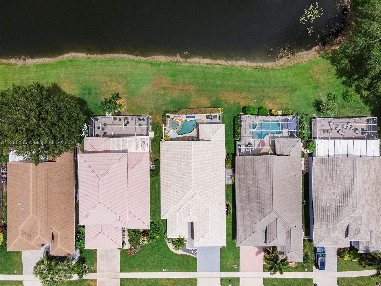 7677 Doubleton Drive Delray Beach, FL 33446 - Photo 3 of 42 an aerial view of a house with outdoor space