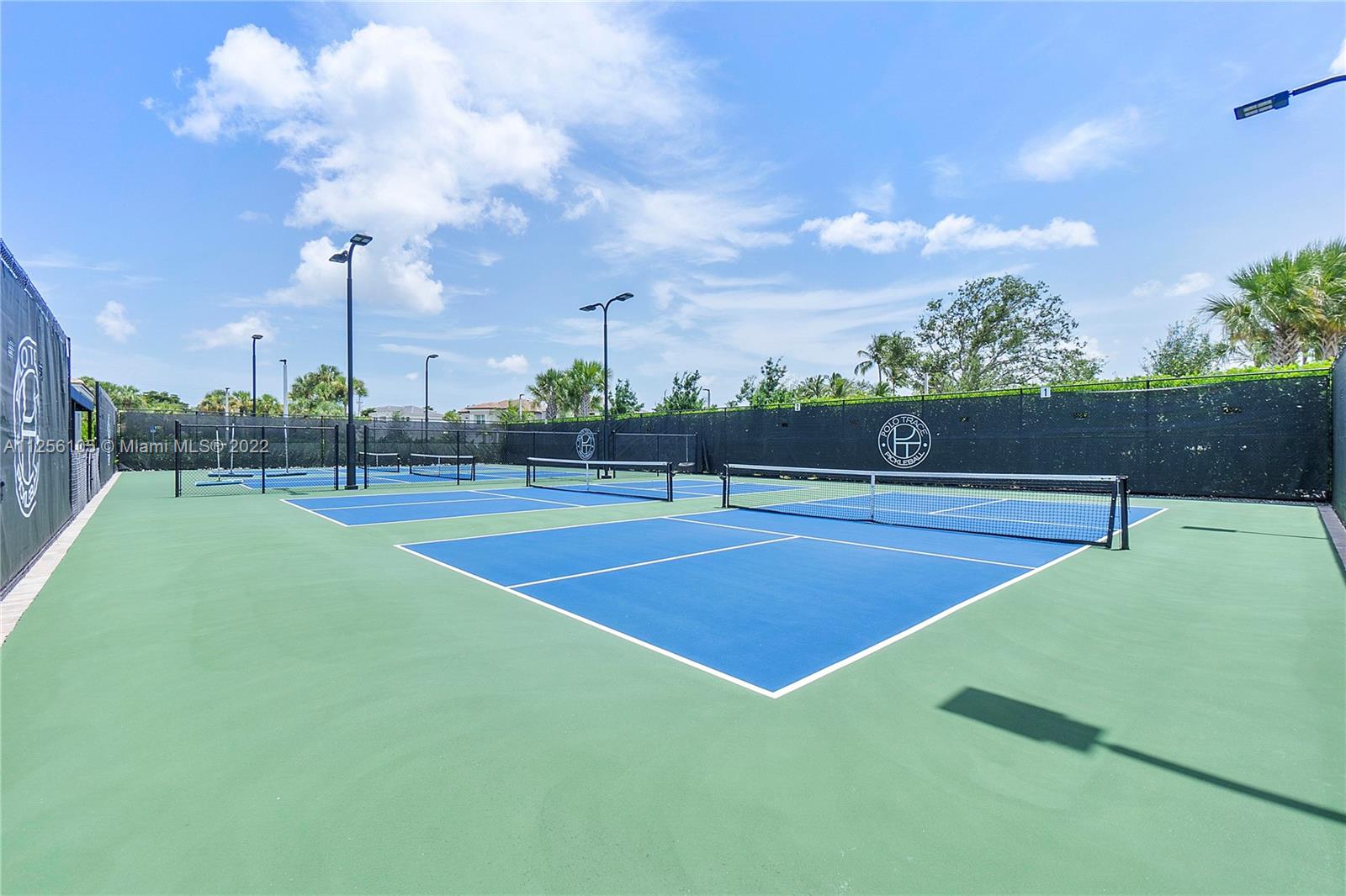 7677 Doubleton Drive Delray Beach, FL 33446 - Photo 38 of 42 a view of a tennis court