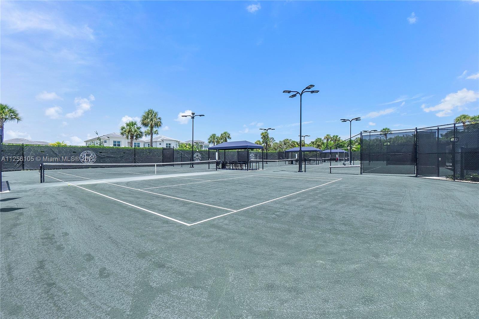 7677 Doubleton Drive Delray Beach, FL 33446 - Photo 39 of 42 a view of a tennis court